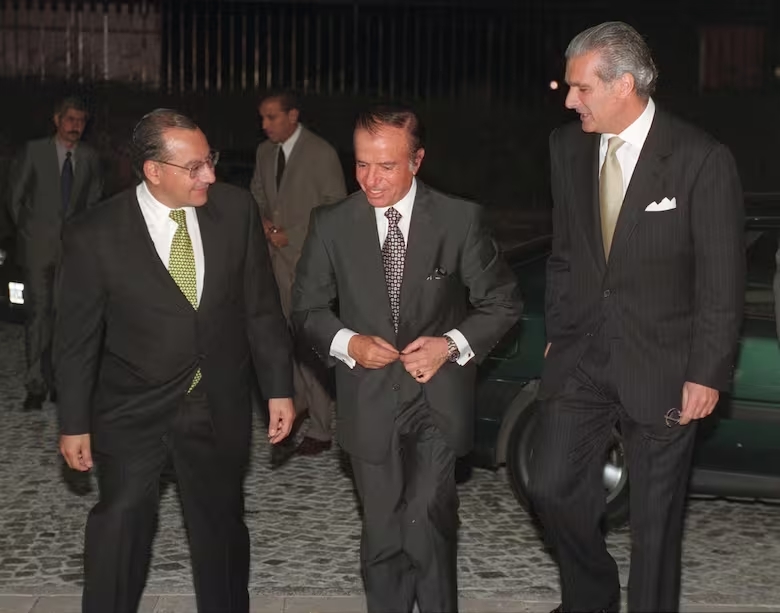 Manuel Rocha junto a Carlos Ménem
