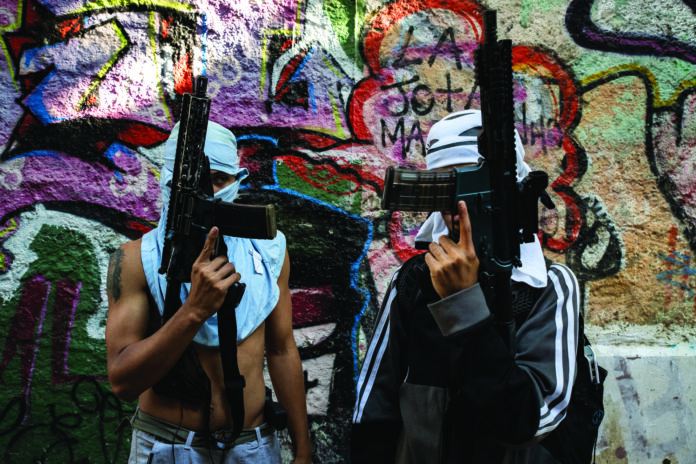 Two armed members of the criminal faction 