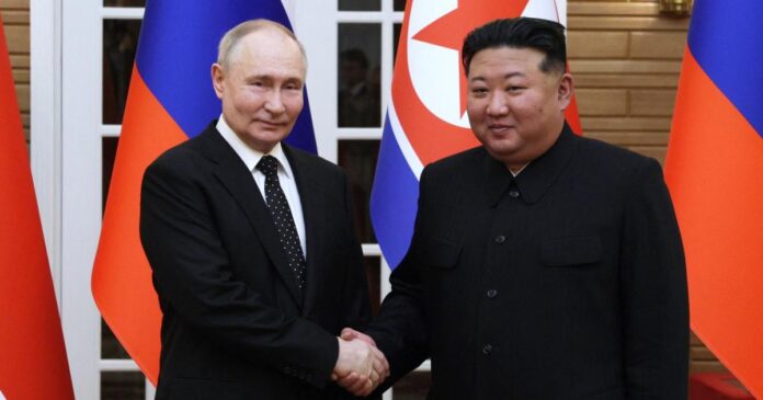In this pool photograph distributed by the Russian state agency Sputnik, North Korea's leader Kim Jong Un (R) and and Russian President Vladimir Putin shake hands after a welcoming ceremony at Kim Il Sung Square in Pyongyang on June 19, 2024. Russian President Vladimir Putin landed in North Korea early on June 19, the Kremlin said, kicking off a visit set to boost defence ties between the two nuclear-armed countries as Moscow pursues its war in Ukraine. (Photo by Gavriil GRIGOROV / POOL / AFP) / -- Editor's note : this image is distributed by the Russian state owned agency Sputnik -- (Photo by GAVRIIL GRIGOROV/POOL/AFP via Getty Images)